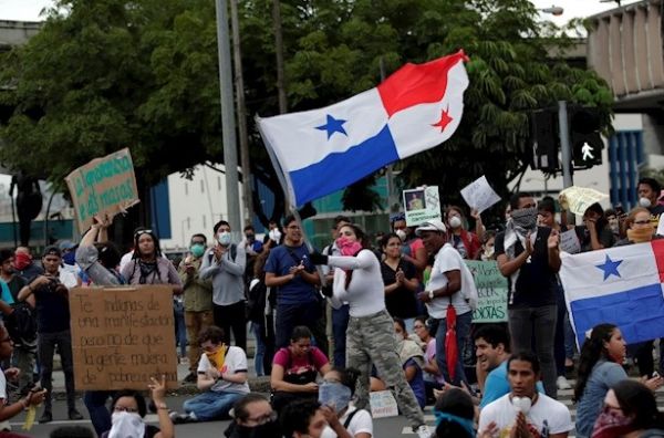 A protester flies a Panama flag during a student protest in front of the National Assembly in Panama City, Panama, Oct. 31, 2019