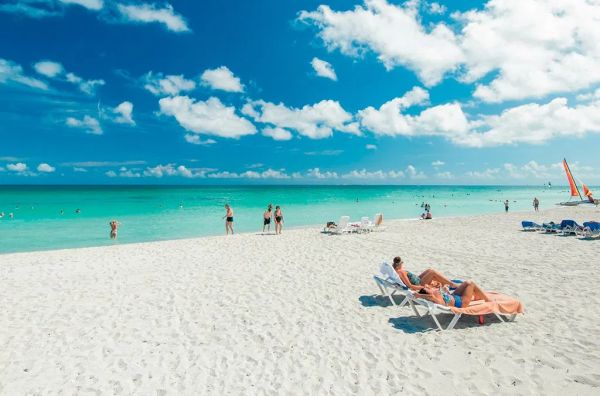 Tourists enjoy the sun, the sea and the sand in Varadero resort