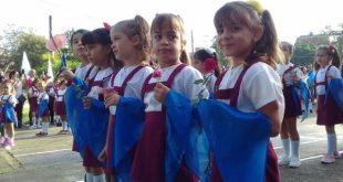 First graders during the ceremony in which they will receive the blue scarf