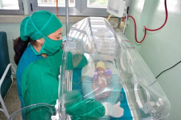 A nurse looks after a baby in the neonatology ward in the provincial hospital of Sancti Spiritus