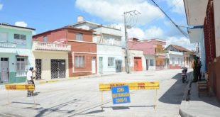 Authorities watch over a restricted area in the city of Sancti Spiritus